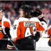 Hockey Roundup: Flyers Match Wings, Osgood Wins U14 Game