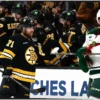 Zacha and Lindholm Propel Bruins to Victory Over Wild