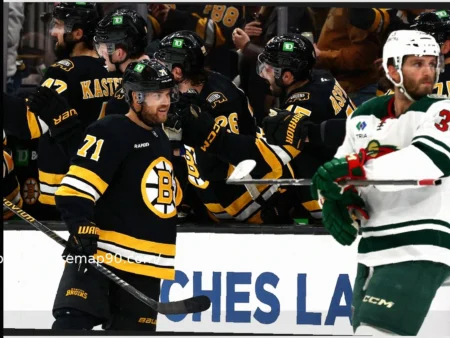 Zacha and Lindholm Propel Bruins to Victory Over Wild